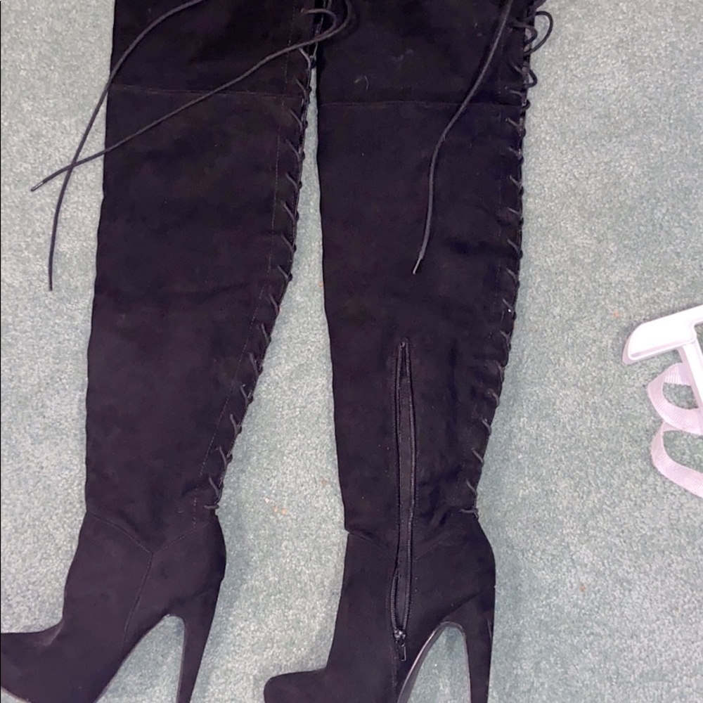 All black knee hightigh up boots in back